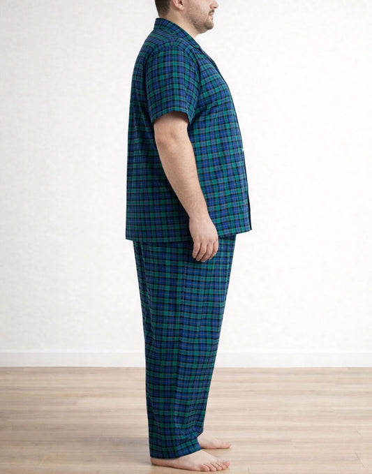 Side view of person wearing a blue and green plaid pajama shirt and Plus Size Pajama Pants against a white background.