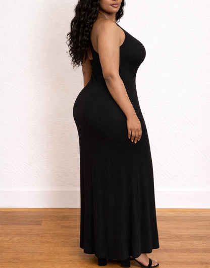 Side view of woman wearing a black Plus Size One Shoulder Maxi Dress on a white background.