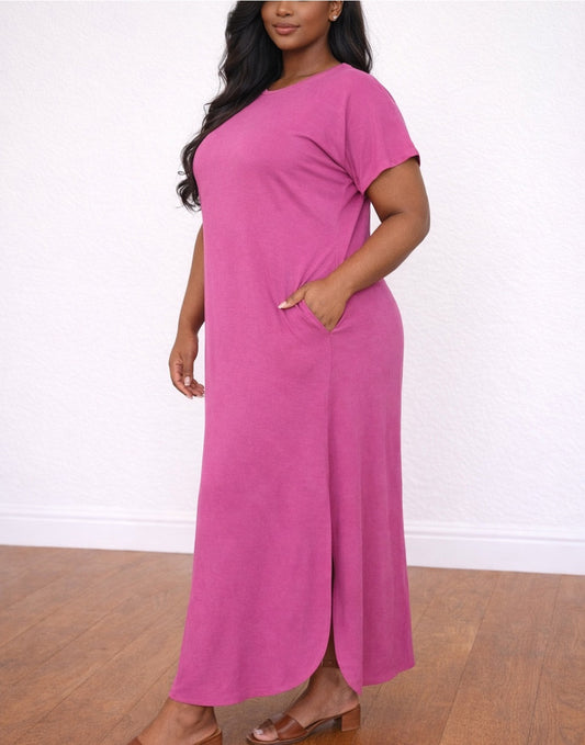 Side view of woman in a pink Plus Size Round Neck Maxi Knit Dress on a white background.