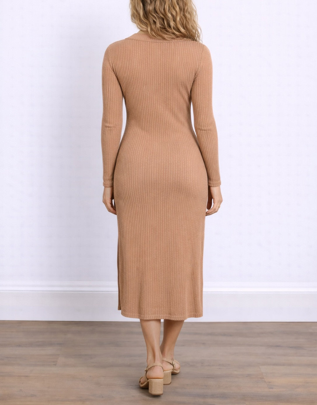 Back view of woman wearing a brown ribbed Polo Neck Knit Dress against a neutral background.