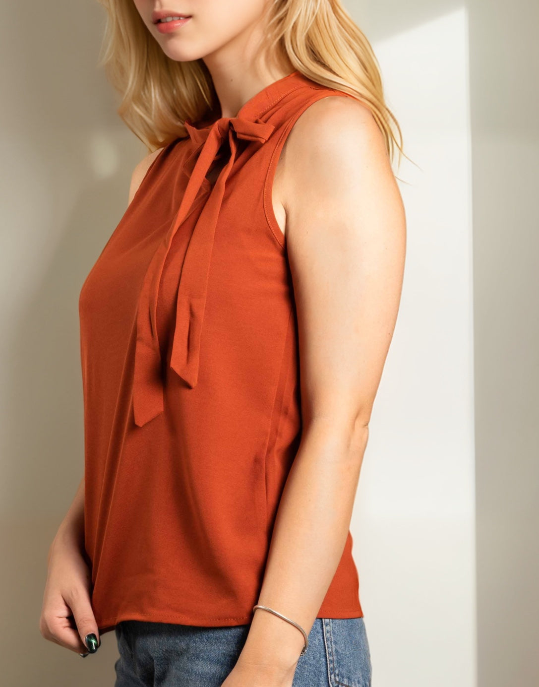 Side view of Side Tie Neck Sleeveless Blouse.