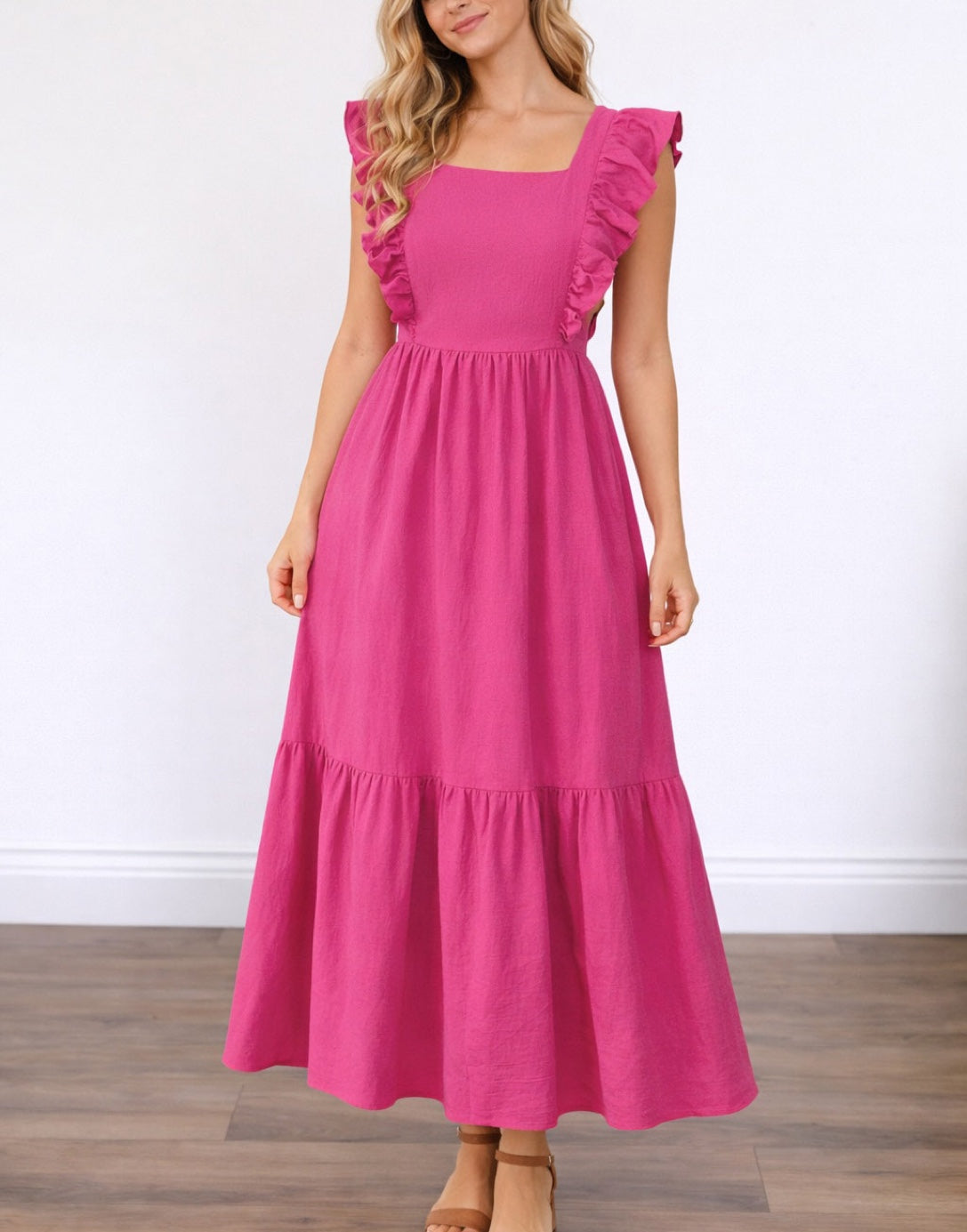 Woman wearing a pink Square Neck Maxi Dress with ruffled sleeves on a white background.