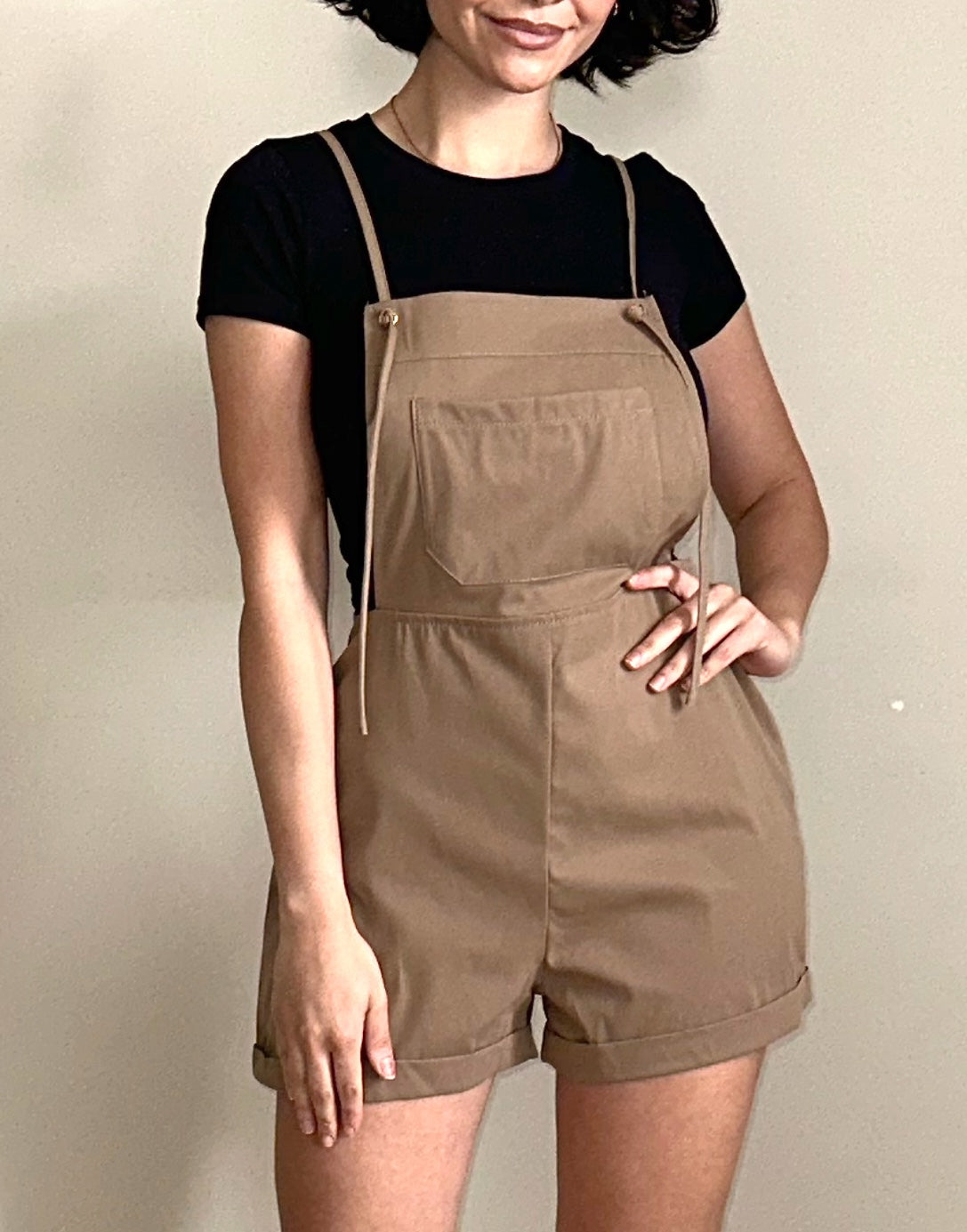 Front view of Suspender Rolled Hem Overall Romper.