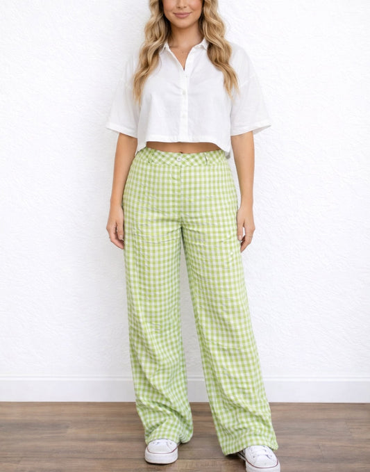 Woman wearing a white cropped top and green checkered Wide Leg High Waist Pants against a white background